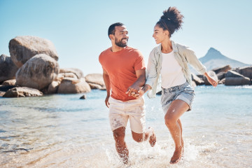 Black,Couple,,Beach,And,Running,While,Holding,Hands,On,Vacation