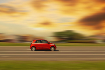 Small,Red,Car.,Fast,Car,Driving,On,Asphalt,Street,In