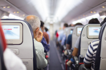 Interior,Of,Airplane,With,Passengers,On,Seats,Waiting,To,Taik