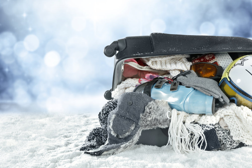 Closeup,Of,Winter,Clothes,In,Suitcase