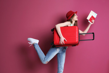 Woman,Traveler,With,Suitcase,On,Color,Background