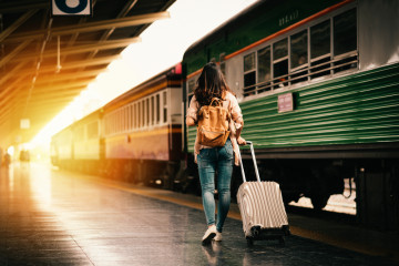 Woman,Traveler,Tourist,Walking,With,Luggage,At,Train,Station.,Active