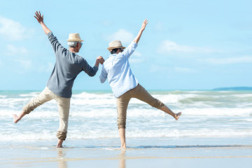 Asian,Lifestyle,Senior,Couple,Jumping,On,The,Beach,Happy,In
