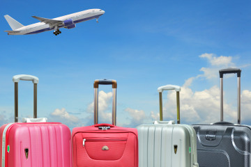 Suitcase,And,Plane,On,Background.,Vacation,Concept