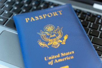 Passport,Of,Usa,On,Notebook's,Keyboard,,Close,Up.,Identification,Of
