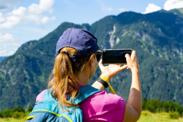 During,Hiking,A,Woman,Takes,A,Picture,Of,Landscapes,In