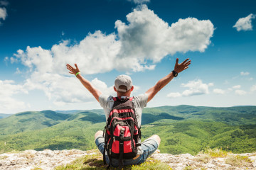 Man,Hiker,Greeting,Rich,Nature,On,The,Top,Of,Mountain