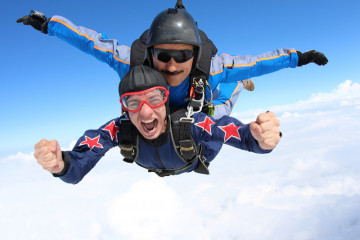 Skydiving.,Tandem,Passenger,Is,Very,Happy.