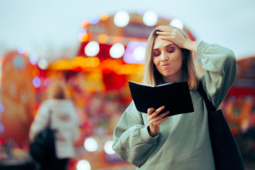 Busy,Woman,Checking,Her,Agenda,For,Schedule,Openings,Unhappy,Tourist