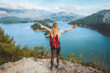 Tourist,Woman,Raised,Hands,Enjoying,Lake,View,Outdoor,Travel,In