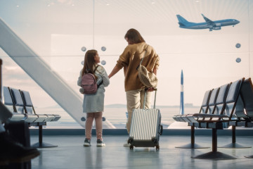 Airport,Terminal:,Beautiful,Mother,And,Cute,Little,Daughter,Wait,For