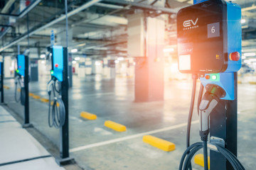 Blurred,Electric,Car,Charging,Station,For,Charge,Ev,Battery.,Plug