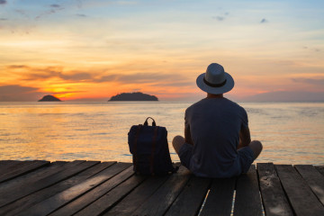 Wanderlust,Travel,,Tourist,With,Backpack,Sitting,Near,The,Sea,,Man