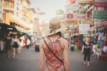 Rear,View,Of,A,Young,Woman,Walking,The,Famous,Backpacker