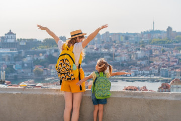 View,From,Behind,Of,Young,Red-haired,Mother,And,Little,Daughter