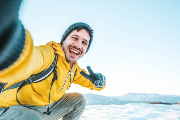 Young,Man,Wearing,Winter,Clothes,Taking,Selfie,Picture,In,Winter