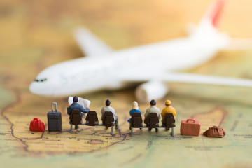 Miniature,People,:,People,Waiting,For,Plane,Using,As,Background
