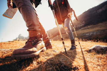 Hiking,Man,And,Woman,With,Trekking,Boots,On,The,Trail