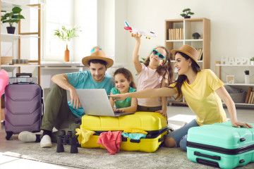 Happy,Excited,Family,And,Daughter,Children,Buying,Payment,For,Flight
