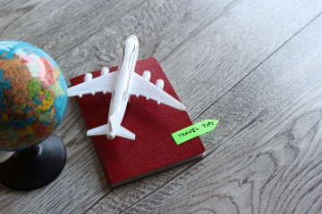 Selective,Focus,Image,Of,Toy,Plane,,World,Globe,And,Passport
