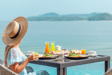 Dinner,With,Sea,View,In,Luxury,Hotel.,Woman,In,Straw