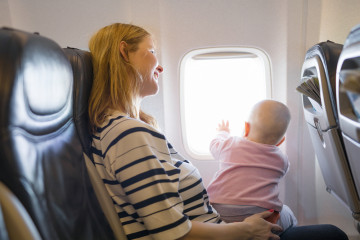 Mother,And,Baby,Traveling,On,Plane