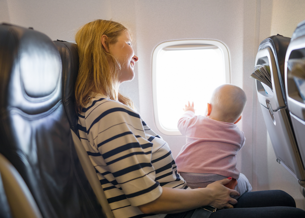 Mother,And,Baby,Traveling,On,Plane
