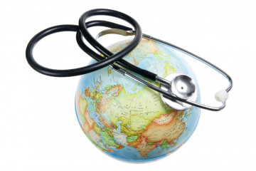Globe,And,Stethoscope,On,White,Pages