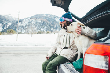 Friends,Playing,With,Dog,On,The,Mountains,,On,The,Snowy