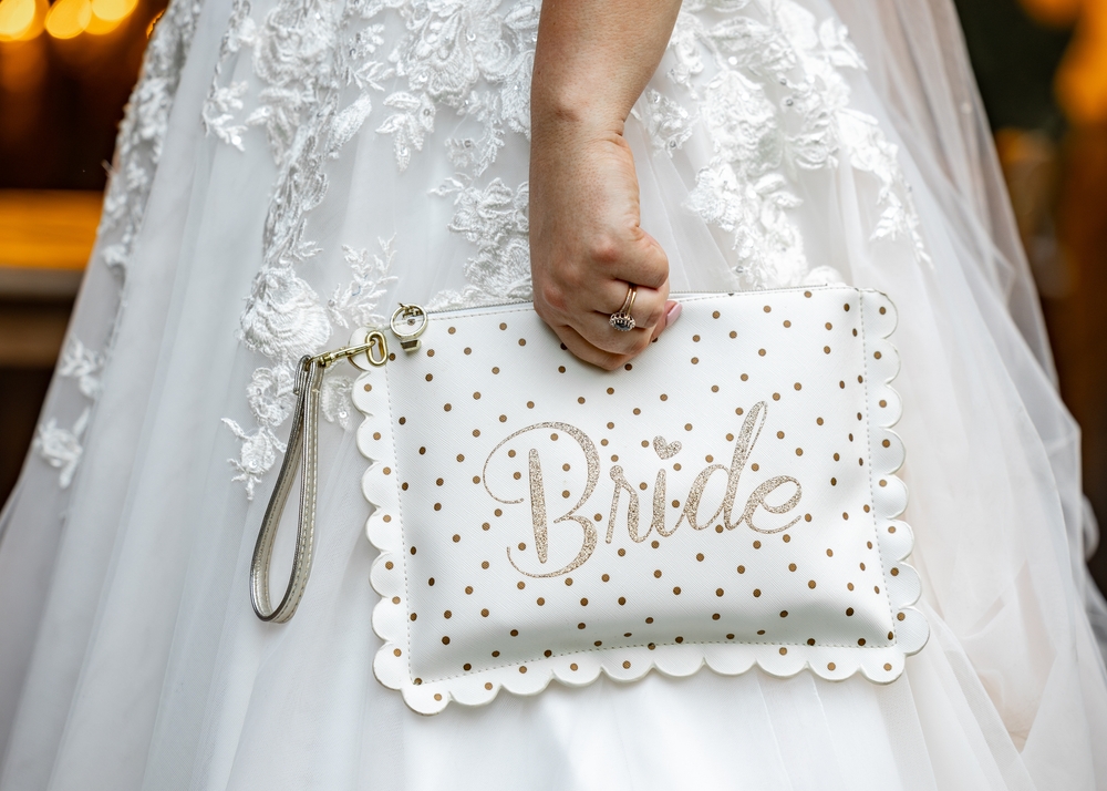 New,Beautiful,Bride,Just,Married,Holding,Hand,Bag,With,Bride