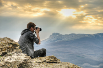 Nature,Photographer,With,Digital,Camera,On,Top,Of,The,Mountain.