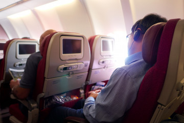 Business,Man,Sleeping,On,Airplane