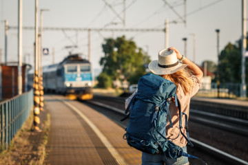 Female,Backpacker,Traveling,By,Train,Alone.,Woman,With,Backpack,And