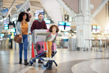 Airport,,Family,And,Child,Excited,For,Flight,With,Suitcase,Trolley