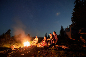 Night,Sky,Over,Mountain,Hill,With,Car,And,Male,Hikers