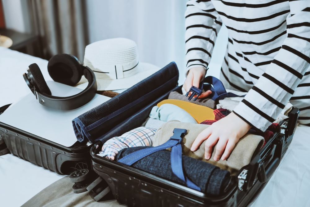 Traveler,Packing,Suitcase,For,Upcoming,Journey