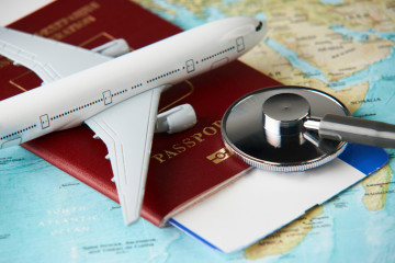 Boarding,Pass,And,A,Passport,Travel,Documents,With,Medical,Stethoscope